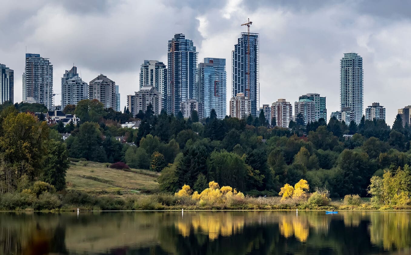 Autumn colours in Deer Lake Park Burnaby with the highrises in the background, British Columbia, Canada